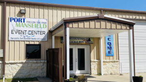 Port Mansfield Event Center entrance with signs.