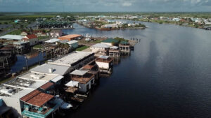 Waterfront houses by a serene coastal bay.