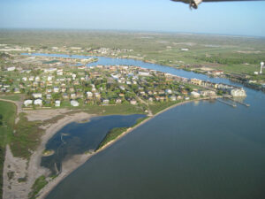 Aerial view of coastal town and bay.