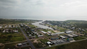 Coastal town aerial view with waterway.